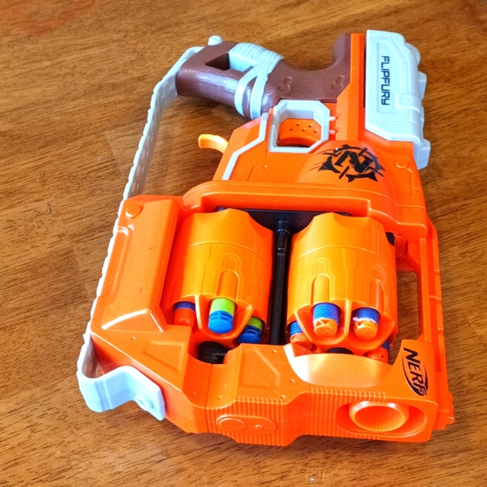 Nerf Zombie Strike FlipFury Blaster - 2 Flipping 6-Dart Drums, Nerf icon…